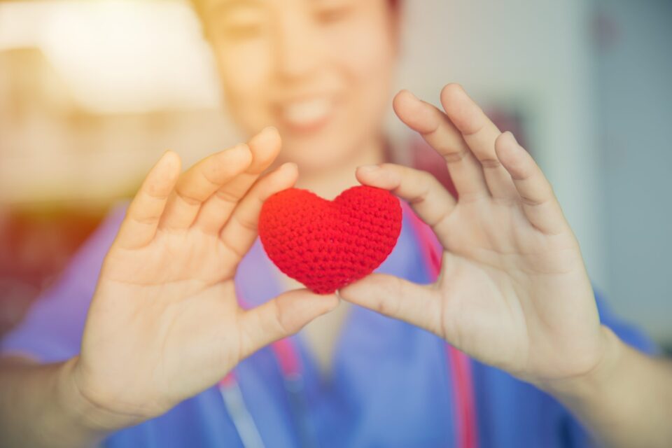 Nurse Sharing red crocheted heart